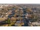 High aerial view captures the street, neighborhood, and houses with an overall sense of community and urban convenience at 1509 Harrill St, Charlotte, NC 28205