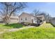 Exterior view of the home highlighting the backyard deck and grassy area at 1509 Harrill St, Charlotte, NC 28205