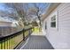 Side of house showing deck and wooden fence at 1509 Harrill St, Charlotte, NC 28205