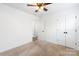 Clean and bright bedroom with neutral carpet, window, ceiling fan and closet at 1509 Harrill St, Charlotte, NC 28205