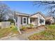 Cozy single-story home with light siding, dark shutters, and well-maintained landscaping at 1509 Harrill St, Charlotte, NC 28205