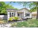 Attractive single Gathering home with a gray exterior, manicured front yard and a welcoming walkway at 1509 Harrill St, Charlotte, NC 28205