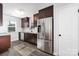 Well-lit kitchen features stainless steel appliances, ample cabinetry, and granite countertops at 1509 Harrill St, Charlotte, NC 28205