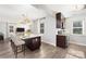 Bright kitchen with granite counters, stainless appliances and an island with bar stool seating at 1509 Harrill St, Charlotte, NC 28205