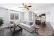 Inviting living room with modern furniture, hardwood floors, and seamless view into the kitchen at 1509 Harrill St, Charlotte, NC 28205