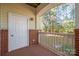 Enclosed outdoor balcony featuring brick and wood at 16312 Redstone Mountain Ln, Charlotte, NC 28277