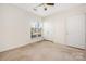 Bedroom with neutral walls, carpeted flooring, and a bright window for natural light at 16312 Redstone Mountain Ln, Charlotte, NC 28277