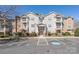 Well-maintained apartment building featuring multiple balconies, visible parking and landscaping at 16312 Redstone Mountain Ln, Charlotte, NC 28277