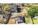 Aerial view of converted barn, a shed, a fenced backyard, and the main house at 1815 W Sugar Creek Rd, Charlotte, NC 28262