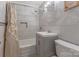 Bathroom featuring a shower with white tile surround, a vanity and a commode at 1815 W Sugar Creek Rd, Charlotte, NC 28262