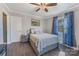 A cozy bedroom with bright, natural light and hardwood floors to match at 1815 W Sugar Creek Rd, Charlotte, NC 28262