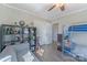 Cozy bedroom features a bunk bed, gray sofa, stylish shelf, and neutral color palette at 1815 W Sugar Creek Rd, Charlotte, NC 28262