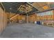 View of converted garage interior, with a unique hanging grid and a bar with stools at 1815 W Sugar Creek Rd, Charlotte, NC 28262