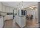 A spacious kitchen with a center island, white cabinets, and stainless steel appliances, ready for cooking at 1815 W Sugar Creek Rd, Charlotte, NC 28262