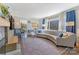 Inviting living room with a large window, hardwood floors, and a comfortable, curved sofa at 1815 W Sugar Creek Rd, Charlotte, NC 28262