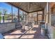 Enclosed patio with outdoor dining table, chairs, and brick flooring with metal enclosure at 1815 W Sugar Creek Rd, Charlotte, NC 28262