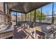 Enclosed patio with outdoor dining table, chairs, and brick flooring at 1815 W Sugar Creek Rd, Charlotte, NC 28262