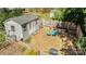 Backyard shed with adjacent fenced-in area with mulch and Adirondack chairs at 1815 W Sugar Creek Rd, Charlotte, NC 28262