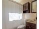 Modest bathroom featuring a toilet, sink vanity, medicine cabinet, and shower with white tile walls at 1909 Stokes Ferry Rd, Salisbury, NC 28146