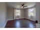 Bedroom featuring hardwood floors, neutral walls, and natural light from two windows at 1909 Stokes Ferry Rd, Salisbury, NC 28146