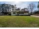 Charming single-story home featuring a well-maintained lawn and inviting front porch at 1909 Stokes Ferry Rd, Salisbury, NC 28146