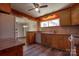 Traditional-style kitchen featuring wood cabinets, laminate countertops, an undermount sink, and stainless steel appliances at 1909 Stokes Ferry Rd, Salisbury, NC 28146