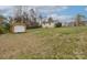 Large yard with shed and house on a partly cloudy day with blue sky at 207 Sigmon Rd, Statesville, NC 28677