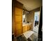 Bathroom with wood vanity, cabinet storage, and views into an adjacent bedroom at 207 Sigmon Rd, Statesville, NC 28677