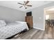 Bedroom with ceiling fan, window and dresser, with a view into a kitchen area at 207 Sigmon Rd, Statesville, NC 28677