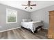 Bright bedroom with natural light features gray walls, offering a cozy retreat for relaxation and rest at 207 Sigmon Rd, Statesville, NC 28677