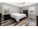 Cozy bedroom with natural light, offers a serene escape with neutral decor and ample space for relaxation at 207 Sigmon Rd, Statesville, NC 28677