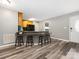 Eat-in kitchen features a bar, wooden cabinets, and gray walls that create a modern and stylish aesthetic at 207 Sigmon Rd, Statesville, NC 28677