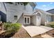 View of the backyard with a concrete patio, some plants and a small deck at 232 Faust Rd, Davidson, NC 28036