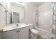 Bathroom with a shower-tub combo, a white single vanity, and a mirror at 232 Faust Rd, Davidson, NC 28036