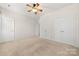 Bright bedroom with neutral carpet, double closets and bright white walls at 232 Faust Rd, Davidson, NC 28036