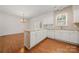 Bright kitchen with tiled breakfast bar and a combined dining space at 232 Faust Rd, Davidson, NC 28036