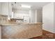 Open kitchen area with granite countertops and white appliances at 232 Faust Rd, Davidson, NC 28036