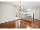 Kitchen area featuring hardwood floors, breakfast bar, and access to dining area at 232 Faust Rd, Davidson, NC 28036