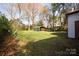 Grassy backyard with a metal carport-style storage building at 2825 Bancroft St # C, Charlotte, NC 28206