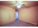 Cozy bedroom with ceiling fan and neutral carpet in a home for sale at 2825 Bancroft St # C, Charlotte, NC 28206