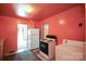 Retro kitchen featuring peach colored walls, cabinets, and white appliances, with patterned floors at 2825 Bancroft St # C, Charlotte, NC 28206