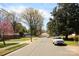 Neighborhood street view with mature trees, colorful landscaping, and houses in a desirable location at 2825 Bancroft St # C, Charlotte, NC 28206