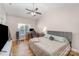 Spacious bedroom with a ceiling fan, wood floors, and a workstation by the window at 4108 Twenty Grand Dr, Indian Trail, NC 28079