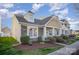 Inviting home showcasing stone and siding accents with a well-maintained lawn at 4108 Twenty Grand Dr, Indian Trail, NC 28079