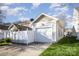 Detached single car garage with white siding, an asphalt drive, and small grass lawn at 4108 Twenty Grand Dr, Indian Trail, NC 28079