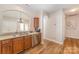 Well-lit kitchen with stainless steel appliances, wood flooring, and a pass-through to the dining area at 4108 Twenty Grand Dr, Indian Trail, NC 28079