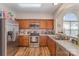 Functional kitchen featuring stainless steel appliances, ample counter space and wood cabinets at 4108 Twenty Grand Dr, Indian Trail, NC 28079