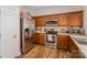 Functional kitchen with stainless steel appliances, wooden cabinets, and ample counter space at 4108 Twenty Grand Dr, Indian Trail, NC 28079