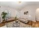 Bright living room featuring modern decor, neutral furniture, and hardwood floors at 4108 Twenty Grand Dr, Indian Trail, NC 28079