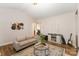 Inviting living room with neutral furnishings, hardwood floors, and stylish accents at 4108 Twenty Grand Dr, Indian Trail, NC 28079